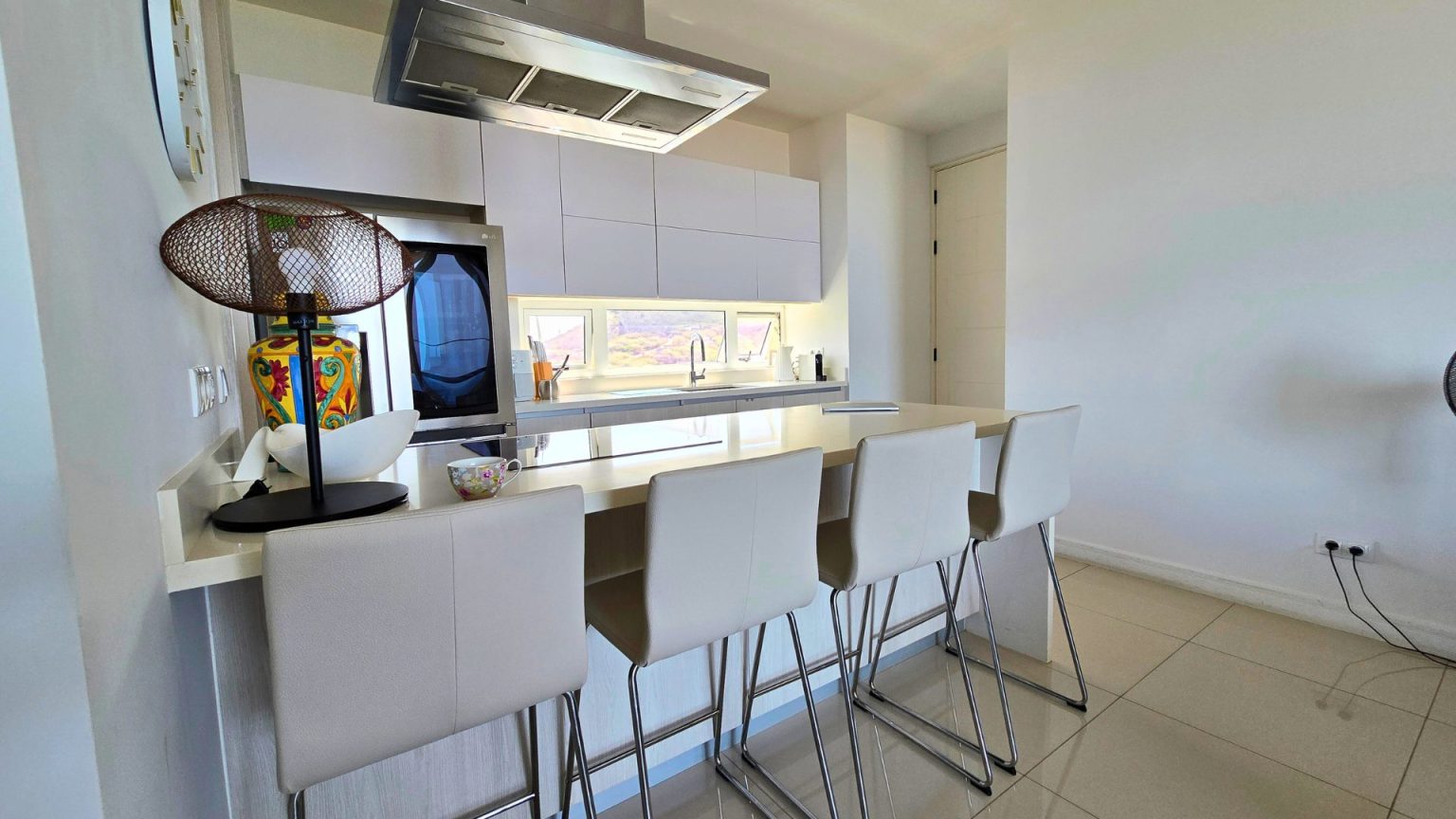 Bright living corner at Cur Azul with seating bathed in natural light